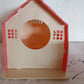 Natural wooden bird house for small garden birds, a charming addition to any outdoor setting.