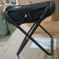 Close-up of the durable Oxford cloth seat and aluminium alloy frame of the folding camping stool.