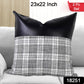 Two 23x22 inch Leather & Cotton Pillow Covers displayed on a bed.