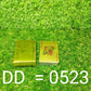 A single gold-plated playing card held, emphasizing its flexibility and durability.