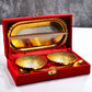 Elegant gold and silver plated brass serving set with two bowls, two spoons, and a red velvet gift box.