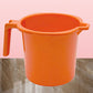 Close-up of the Bathora plastic bathroom mug's sturdy handle and vibrant color.