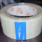 Roll of transparent cello tape, perfect for general purpose sealing.