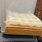 Foldable plastic egg tray neatly packed, ready for convenient storage or transport.