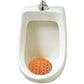 Round urinal screen mat preventing splashes in a public washroom.