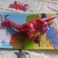 A single red dinosaur-shaped eraser showcasing its detailed design.