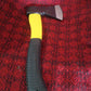 Hatchet axe demonstrating its use for clearing brush in a garden setting.