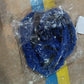 Detailed view of the durable connectors on the expandable garden hose.
