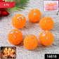 Bright orange laddu-shaped decorative wax candles arranged for Diwali celebration
