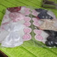 Packaging for the single multicolour hair bow clip.