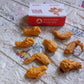 A group of chicken erasers in various poses, suggesting movement and fun, perfect for kids' playtime.