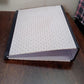 Side view of the button clip box file, highlighting its compact design.