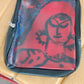 Side view of compact multipurpose zipper pouch with traditional design