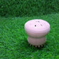 Brightly lit silicone facial cleansing brush in its packaging, ready for use.