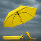 Bright yellow banana shaped umbrella, folded neatly.
