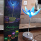 The elegant musical lamp displayed with its petals open, ready to provide both light and soothing melodies.