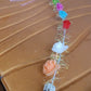 Model wearing LED Flower Crown Headband illuminated with vibrant multicolor LED roses
