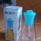 Vertical close-up shot of the elegant oil dispenser bottle, emphasizing its design.