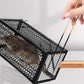 A trapped mouse visible inside the live catch cage, demonstrating humane capture.