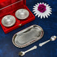 Close-up of the polished silver plated brass serving set, highlighting the intricate details of the bowls and spoons.