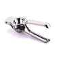 Stainless steel lemon squeezer extracting juice from a sliced lemon.