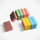 Stack of vibrant, multi-purpose dish cleaning sponges for kitchen use.