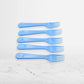 A close-up of the tines of a reusable plastic fork, showing its sturdy construction.