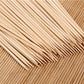 Close-up of raw meat and vegetables prepared on natural bamboo skewers.
