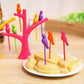 Set of colorful bird fruit forks with a tree holder, perfect for kids' snack time.