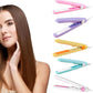 A hand demonstrating the mini hair styler creating soft curls on long hair.
