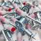 Stack of 100 steel nail gun nails ready for efficient use