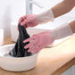 Reusable household cleaning gloves in use at home