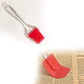 Durable silicone spatula and brush, ideal for cake mixing.