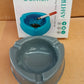 Durable grey plastic ashtray placed on table, ideal for home or office