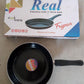 Lifestyle shot of the tadka fry pan used for tempering spices.