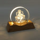 3D Lord Ganesha LED lamp emitting warm light in dim room