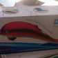 Person enjoying soothing stress relief using the Dolphin Handheld Massager.
