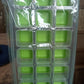 A single green 18-cavity silicone ice cube tray, showcasing its bright color and design.