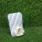 The self-adhesive mop holder securely gripping a broom handle on a wall.