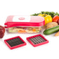 Ganesh red vegetable and fruit chopper disassembled, displaying all its components.