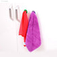 The lightweight towel holder displayed, emphasising its ease of handling and portability.