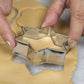 Close-up shot of the collection of stainless steel cookie cutters showing their varied sizes.