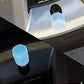 Set of four fluorescent car tire air stem covers in mixed colours.