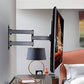 Adjustable TV wall mount installed on a white wall