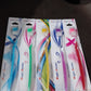 Ergonomic handle of a plastic toothbrush designed for comfortable grip for all ages.
