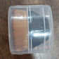 BeautyBare foundation brush neatly stored inside its round, portable protective case.