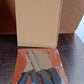 Kitchen tools including stainless steel knives and plastic chopping board for easy food preparation