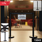 Barrier stand crowd control pole with retractable belt in commercial setting