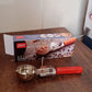 Angled view of Apex ice cream scoop with stainless steel head and handle