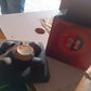 Matte black ceramic tea set displayed on a wooden table for tea time
